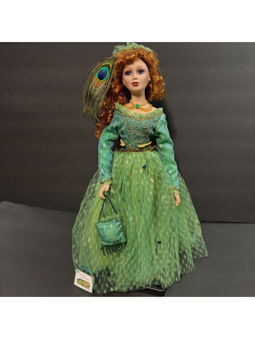 Heritage Signature Collection Peacock Porcelain Doll. with Stand